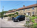 Terraced houses on Combe Road in EX12 4AS