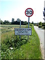 Swannington (Upgate) Village Name sign on School Road in NR9 5NN