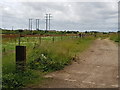 Track to solar farm and power lines in PO22 9AF