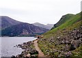 Walking a lakeside path by Ennerdale Water in Cleator Moor East and Frizington Ward