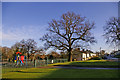 Playground and houses in eastern end of Lonsdale Drive, Enfield in EN2 7RG