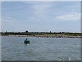 Looking past a buoy in Brightlingsea Creek towards Cindery Island in CO7 0AR