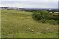Landfilled site with energy from waste plant in the distance in MK18 2FE