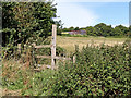 Farmland and stile west of Stourton in Staffordshire in DY7 5BE