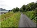 Minor road and shoreline of Loch Duich at Upper Ardelve in IV40 8EY