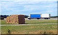 Trucks and Bales on the Airfield in West Thorney