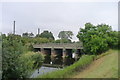 Grantham to Peterborough line crossing the Maxey Cut at Lolham Bridges in PE6 9HG
