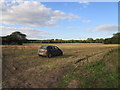 Car in a stubble field, Congham in PE32 1DS
