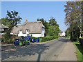 Shepreth High Street: plaster, thatch and bins in SG8 6QH