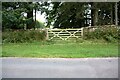 Gateway into Roundend Wood from NE side of rural road in CA11 8ST