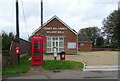 Elizabeth II postbox and telephone box on Church Road, Tilney All Saints in PE34 4SR