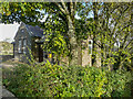 Laycock Village Hall, seen through trees in BD22 0PN