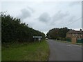 Village sign on road through West Knighton in DT2 8PE