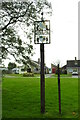 Lawshall village sign and bungalows on Hall Mead in IP29 4PB
