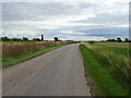 Minor road flanked by drains, Old Leake in PE22 9PE