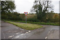 Road junction on Welsh Lane in MK18 5DJ