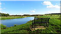 On Wensum Way - seat overlooking river at confluence of Penny Spot Beck & River Wensum in NR20 4JS