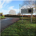 Bilingual village name sign, Usk Road, Raglan, Monmouthshire in NP15 2HD