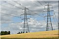 Pylons and fields at harvest time, Burgh in Burgh