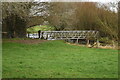 Footbridge over the River Bourne near Ford in SP1 3DE