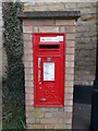 Wall-mounted EIIR postbox on High Street, Maxey in PE6 9EP
