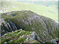 Small lochan on cliff spur in IV40 8JL