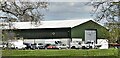Vehicles near a large shed SW of Westhouse Farm in BN5 9BJ