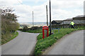 Telephone box and bench at the end of Tinkley Lane in S42 6AW