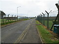 Road leaving Leuchars and its military base in KY16 0LJ