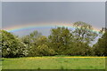 Rainbow beyond trees, Bromley Common in BR2 8HA