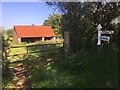 Barn and SCC fingerpost near Leigh Wood railway crossing in TA4 4BL