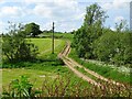 Rutted farm track crossing a stream in Weston Underwood