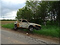 Burned out car beside minor road near Balnuith in DD4 0RE