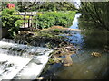 A weir and footbridge in BS49 5AP