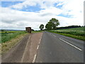 Bus stop and shelter on the A934 near Smithy House in DD9 6UE
