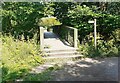 Footbridge over River Caldew at junction of footpaths in CA2 4SW