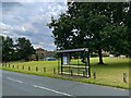 Bus stop and shelter on The Green in WF4 2LY