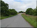 Minor road about to join the A90 at Meikle Fiddes in AB30 1LN