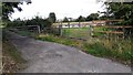 Field gateway and gated road near St Owens in CA6 4RP