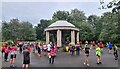 Runners in Macclesfield parkrun assemble by the bandstand in South Park in SK11 7QA