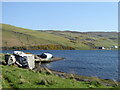 Abandoned boats on the shore of Loch Harport at Taoileann an Triainn in IV47 8ST