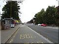 Bus stop and shelter on Main Street, Belshill in ML4 1EN