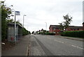 Bus stop and shelter on Old Edinburgh Road (B7001) in G71 6AN