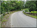 Minor road and bridge crossing the Tollie Burn at Ardross in IV17 0YF
