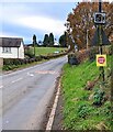Signs alongside Usk Road, Llangybi, Monmouthshire in NP15 1QF