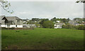 Field and houses, Porthilly in PL27 6JX