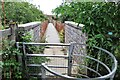 Footbridge across old railway line in MK18 3LY