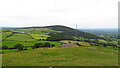 On the summit of Moel Hiraddug with view towards Mynydd y Cwm in LL18 6AU