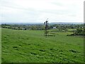 Grassland and wind pump near Caldcoats House in G77 6WE