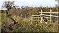 Stile for footpath from SW side of rural road opposite Brackenbrae in CA5 7QQ